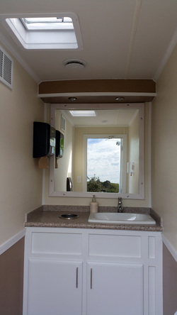 LUX Portable Restroom Trailer Interior - Night - Men's Restroom - Urinal